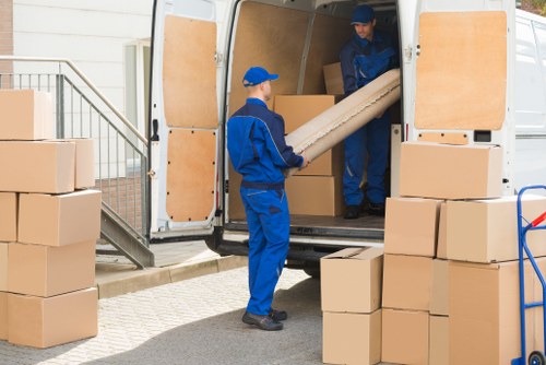 Acton Storage team handling delicate items with care